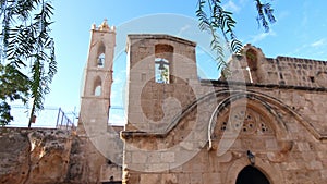 View of ancient temple with belfries in slow motion. Temple with tall bell tower