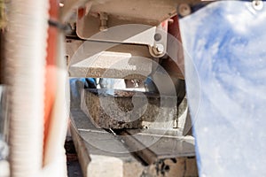 View through an angle grinder cutting paving stone