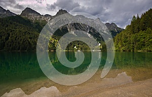 View of Anterselva lake on cloudy day in Italy photo