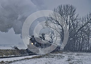 View of An Antique Restored Steam Locomotive Blowing Smoke and Steam