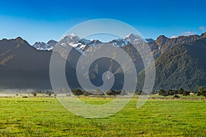 View of Aoraki Mount Cook and Mount Tasman from Lake Matheson, New Zealand