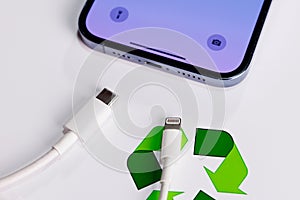 View of Apple Iphone with Both Usb-c and Lightning Cable Charger. EU Forced Apple Iphone to Use Usb-c Instead of