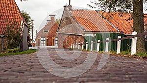 View from approach route over on traditional village with farmhouses and old pavements.