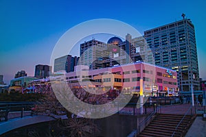 View of Aqua City and Fuji television building at Odaiba, Tokyo in the evening with twilight sky