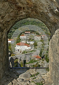 View of aqueduct through stone window