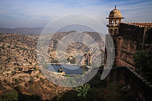 View of the Aravalli Hills, Water Tank and one of the towers of the Nahargarh Fort, Jaipur, Rajasthan, India