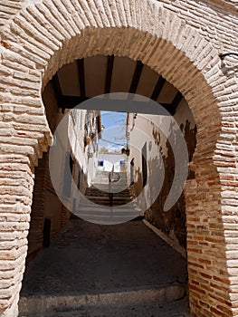 View through arch in the back streets of Jewish quarter in Toledo, Castile La Mancha, Spain.