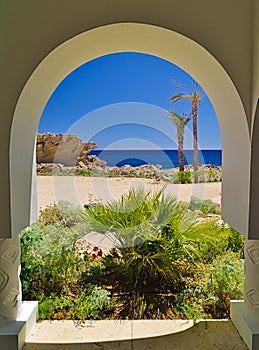 View from arch passage to sea, summer time.