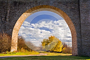 View through the arch of the stone bridge-viaduct. S. Ostriv, Ternopil region, Ukraine