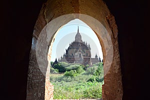 View through arch to Bagan temple, Myanmar photo