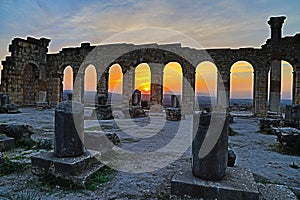 View of the archaeological Site of Volubilis at sunset, Morocco.