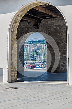 A view through arched entrances towards the harbour at Koper, Slovenia