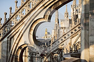 View through the arches and spires of the gothic cathedral Duomo di Milano, Italy.