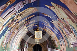 View of archway murals and lantern.