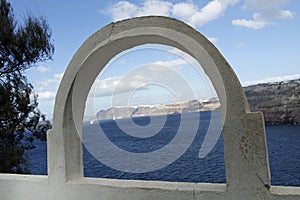 View through archway to aegean sea of santorini island