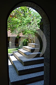 View of the archway to the street and the stairs upwards.