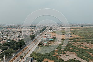 a view of an area in the middle of nowhere, with trucks on the road