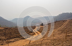 A view on the arid mountains with smog in summer in northern Thailand