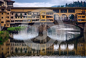 View from the Arno River to the Ponte Vecchio bridge. The old city of Florence. Italy.