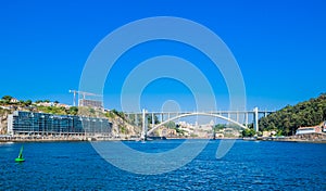 View of Arrabida Bridge in Porto Portugal, crossing the Douro River and linking Porto with Vila Nova de Gaia