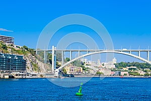 View of Arrabida Bridge in Porto Portugal, crossing the Douro River and linking Porto with Vila Nova de Gaia