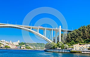 View of Arrabida Bridge in Porto Portugal, crossing the Douro River and linking Porto with Vila Nova de Gaia