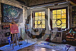 View of an art studio with painting with paintings on the easels