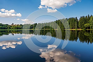 View of the artificial mountain lake Trei Ape. Photo taken on 5th of July 2021 at the Trei Ape lake, Caras-Severin county, Romania
