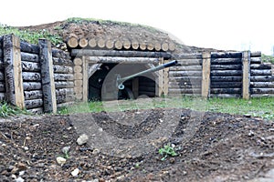 Artillery gun in dugout