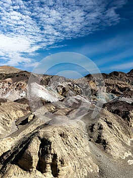 A view of The Artist Pallette, Death Valley National Park California with its emerald and pink shaded hill side