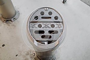 View of an ashtray inside a designated smoking booth for smokers at Nagano, Japan