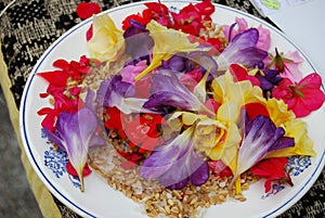 View of an assortment of edible flowers with plate