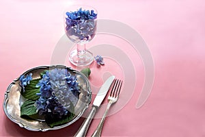 View of an assortment of edible flowers with plate and fork