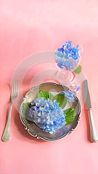 View of an assortment of edible flowers with plate and fork