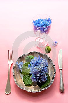 View of an assortment of edible flowers with plate and fork