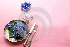 View of an assortment of edible flowers with plate and fork