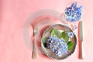 View of an assortment of edible flowers with plate and fork