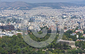 View of the Athens and the ancient Temple of Hephaestus, a doric greek temple in the north-west side of the Agora of Athens,