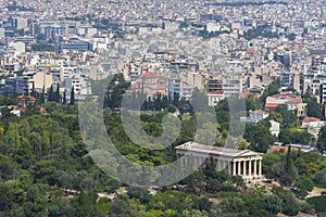 View of the Athens and the ancient Temple of Hephaestus, a doric greek temple in the north-west side of the Agora of Athens,