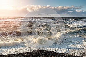 View on Atlantic ocean, Strandhill beach, county Sligo Ireland. Wave hits the coast creating splash of water