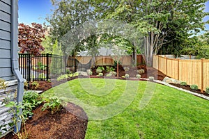 Nice fenced backyard with new planting beds