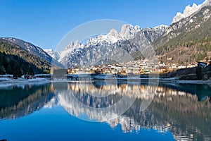 The view of Auronzo and the frozen lake Santa Katerina, Dolomites photo