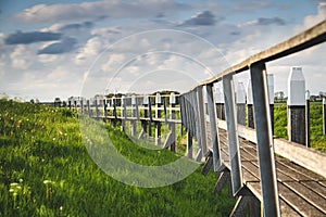 View on the authentic old harbor with wooden seawall and wooden Jetty, Schokland, Netehrands