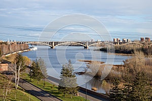 View of the auto-pedestrian communal bridge 1961 over the Yenisei River in the city of Krasnoyarsk. Russia