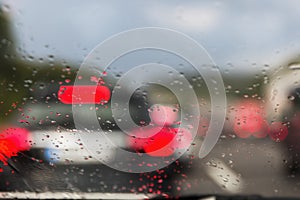 View on Autobahn traffic through a wet windshield