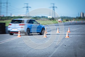 View of autodrome race circuit racetrack with a line of cars driving and racing, with audience and during rally autocross racing