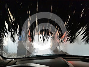 View of an automatic car wash from inside a car