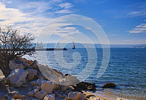 View of autumn beach and sailing boats Varna bay Bulgaria