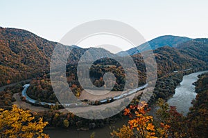 View of autumn scenery of Domasinsky meander in Zilina region, Slovakia. The Vah River flows past autumn forests in a U-shape