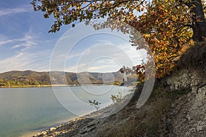 View with autumn tree of Ticha dam